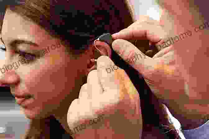 Audiologist Fitting A Hearing Aid On A Patient's Ear Strategies For Selecting And Verifying Hearing Aid Fittings