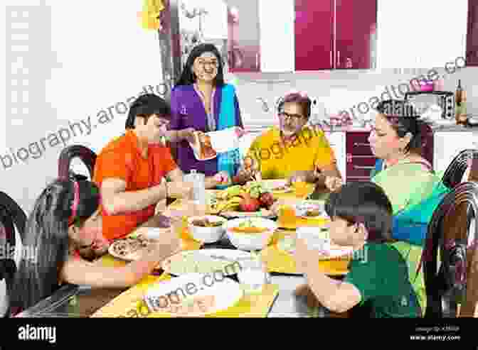 Indian Joint Family Gathered Around A Dining Table, Sharing A Meal Indian Joint Family Samit Bhattacharjee